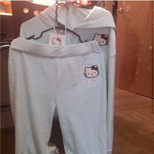 A light blue activewear hello kitty set, and has tags with it.